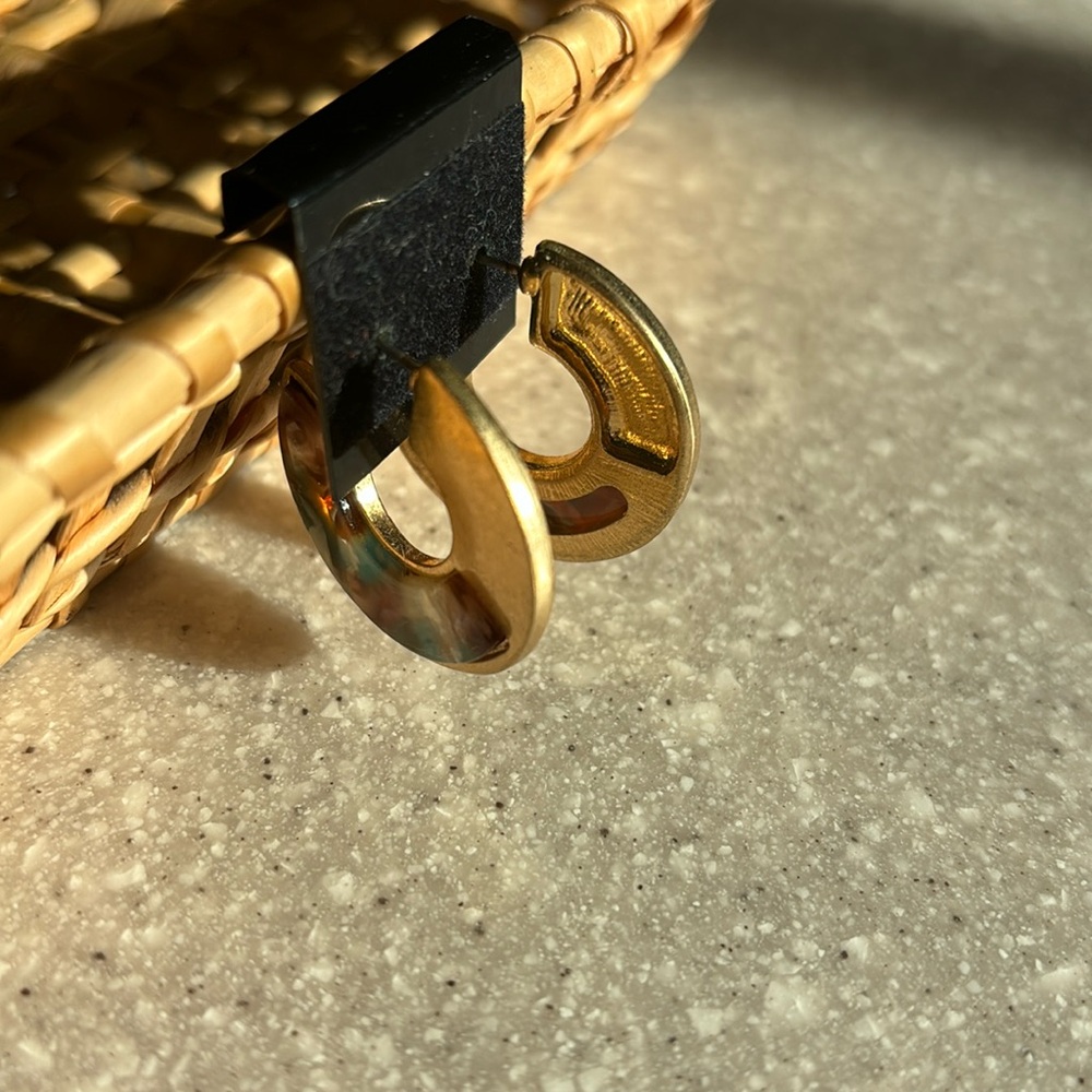 Gold hoops with purple enamel design